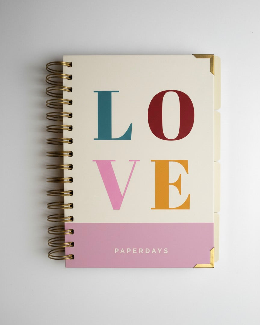 Notebook with 'LOVE' in colorful letters and 'PAPERSDAYS' branding on a light gray background